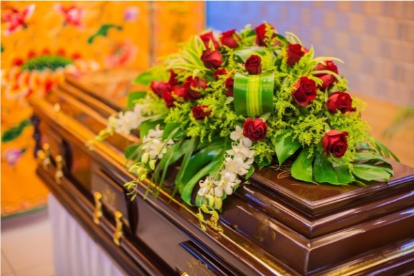 Flowers and wreath on coffin